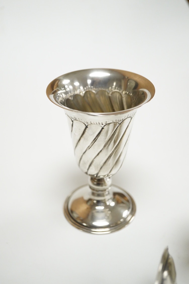A pair of Turkish? 900 standard white metal goblets, 11.1cm, together with an 800 standard small beaker, 7oz.